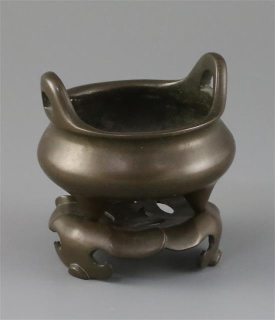 A Chinese bronze tripod censer and stand, Xuande mark but later Qing dynasty, censer 9.5cm diam.